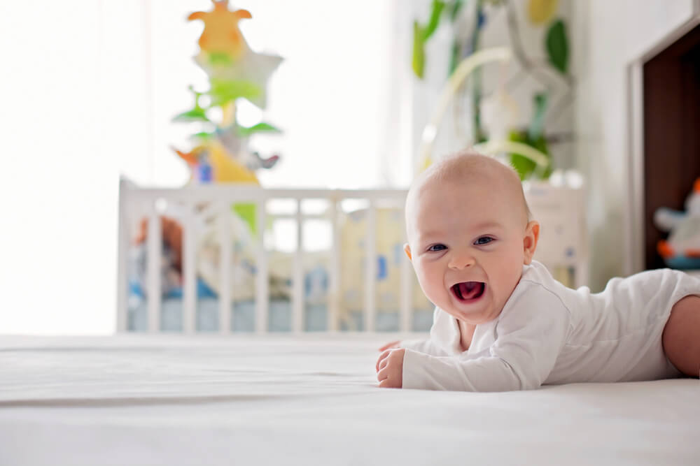 what should a four-month-old baby be doing
